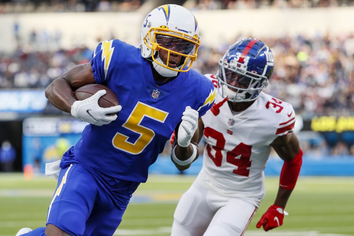 Chargers wide receiver Josh Palmer (5) outruns Giants cornerback Jarren Williams for a touchdown.