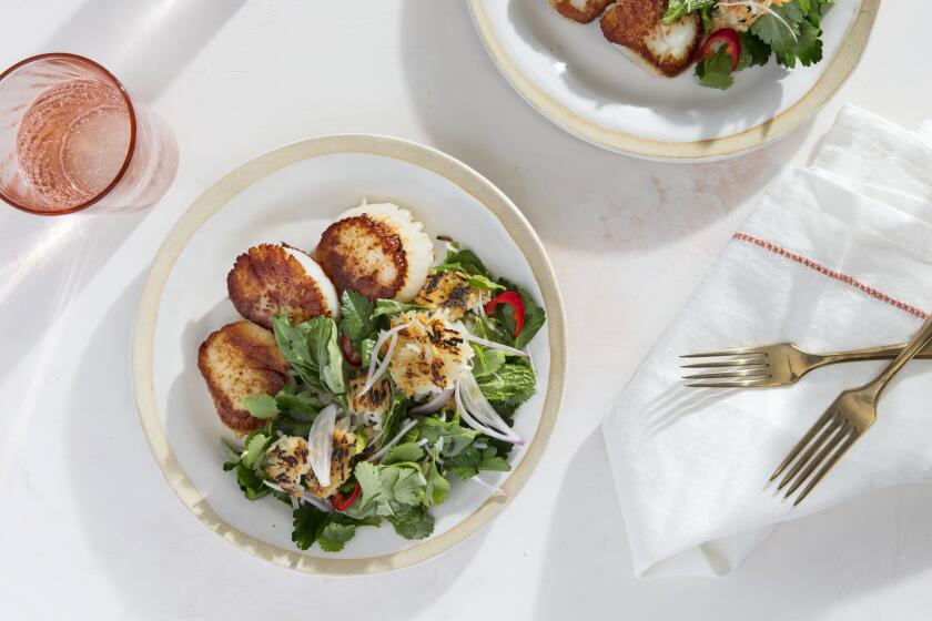 LOS ANGELES, CALIFORNIA - Feb. 27, 2020: Scallops with Crispy Rice and Herb Salad, a recipe by Ben Mims, photographed on Thursday, Feb. 27, 2020, at the PropLink Studio in Arts District, Los Angeles. Prop styling by Rebecca Buenik. (Silvia Razgova / For The Times) Assignment ID: 498232