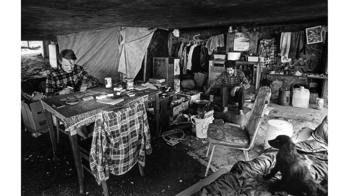 Nov. 21, 1985: Don Culshaw, 24, left, and Bernard Acquin, 39, in makeshift housing underneath a freeway.