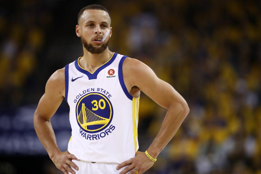 OAKLAND, CA - MAY 20: Stephen Curry #30 of the Golden State Warriors looks on during Game Three of the Western Conference Finals of the 2018 NBA Playoffs against the Houston Rockets at ORACLE Arena on May 20, 2018 in Oakland, California. NOTE TO USER: User expressly acknowledges and agrees that, by downloading and or using this photograph, User is consenting to the terms and conditions of the Getty Images License Agreement. (Photo by Ezra Shaw/Getty Images)