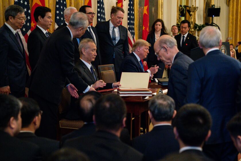 WASHINGTON, D.C. - JANUARY 15: U.S. President Donald Trump and Chinese Vice Premier Liu He at the formal signing of the Phase 1 trade deal with China at the East Room of the White House on Wednesday, Jan. 15, 2020 in Washington, D.C. The trade deal, which the President portrays as a landmark agreement that will provide a big boost to the US economy and potentially his reelection. (Kent Nishimura / Los Angeles Times)