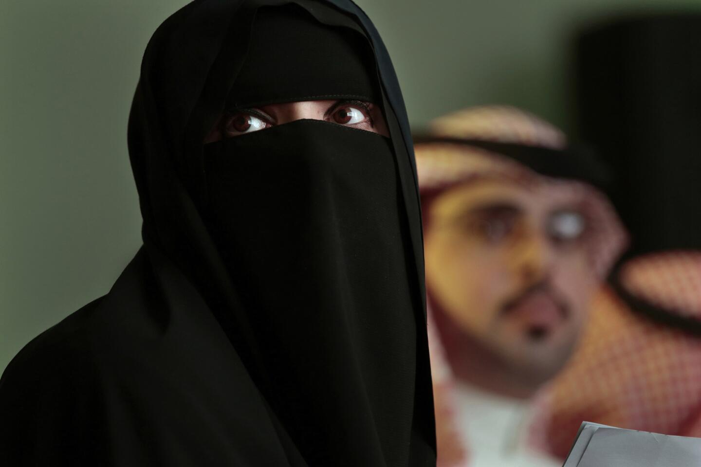 One of the few female journalists in Riyadh attends a news conference. Saudi Arabia women are entering the workforce in higher numbers, but they still face many challenges.