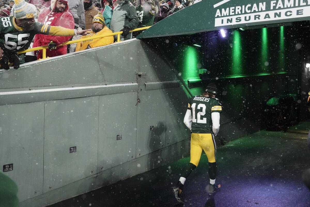 FILE - Green Bay Packers' Aaron Rodgers leaves the field after an NFC divisional playoff NFL football game against the San Francisco 49ers, Saturday, Jan. 22, 2022, in Green Bay, Wis. The Packers have grown all too accustomed to postseason heartbreak over the last decade or so, but the unexpected manner in which they fell 13-10 to the San Francisco 49ers in last season’s divisional playoffs has made it particularly tough to get over. (AP Photo/Morry Gash, File)