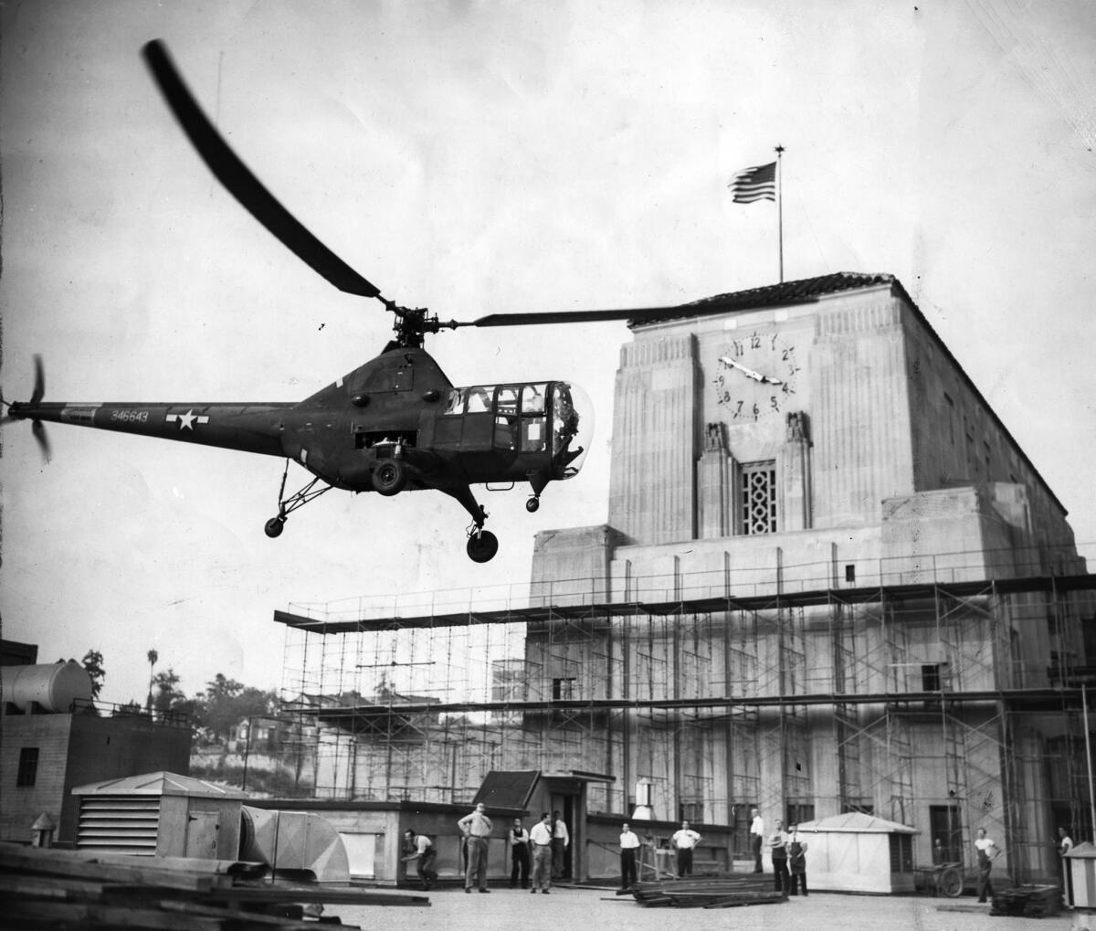 Oct. 26, 1946: A helicopter flown by Army pilot Lt. Edward H. Frost drops Coliseum football game negatives on the roof of the Los Angeles Times building. UCLA beat Santa Clara 33-7.