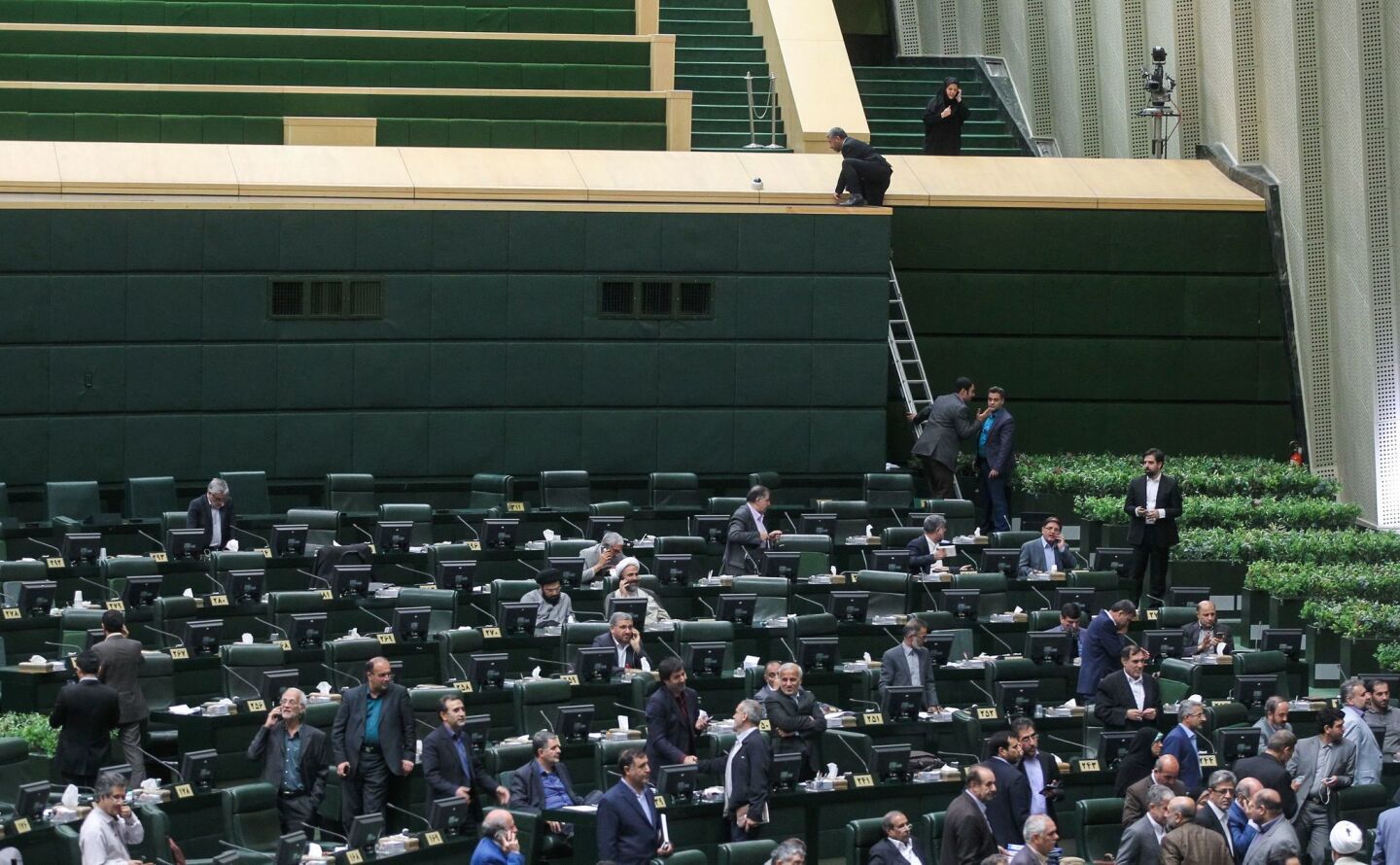 Lawmakers gather inside the main hall of the Iranian parliament on Wednesday.