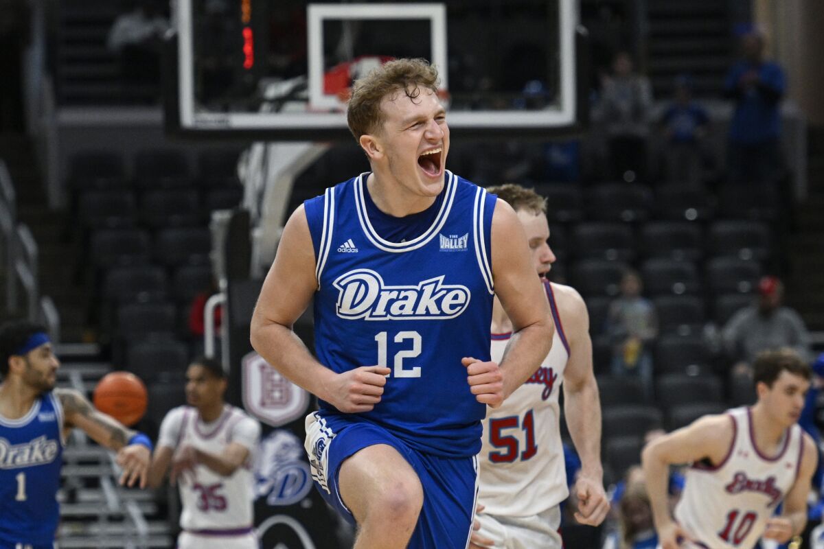 Drake guard Tucker DeVries reacts after scoring a three-point basket against Bradley.