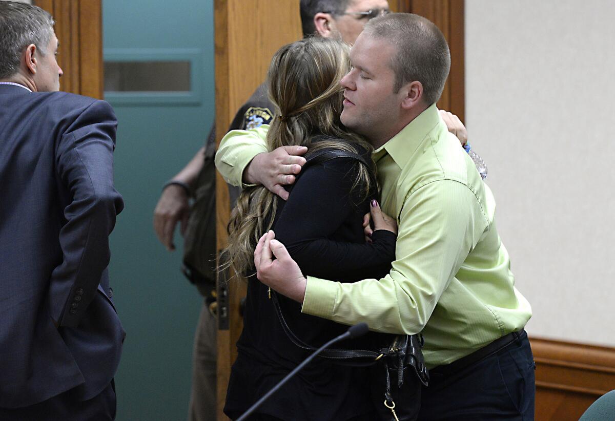 Jordan Byelich, right, husband of bicyclist Jill Byelich, hugs Mitzi Nelson after her sentencing Wednesday. Nelson was distracted by her cellphone when she struck and killed Jill Byelich.
