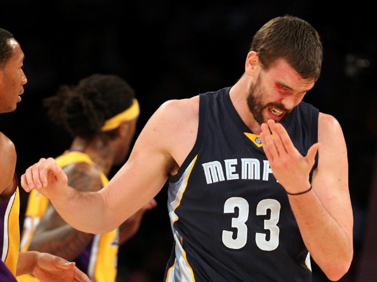 Grizzlies center Marc Gasol reacts after getting his above his right eye during a game Friday night at Staples Center.