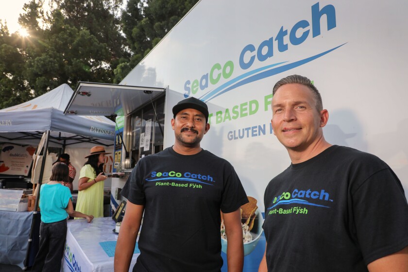 Felix Alcaide and Mike Perez, co-founders of SeaCo Catch plant-based Fysh Tacos in their mobile food trailer.