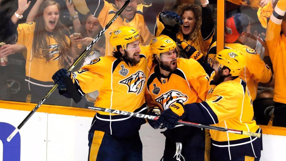 Nashville Predators' Craig Smith (15) celebrates with teammates after scoring a third period goal against the Pittsburgh Penguins in Game 3 of the NHL Stanley Cup Final, Saturday.