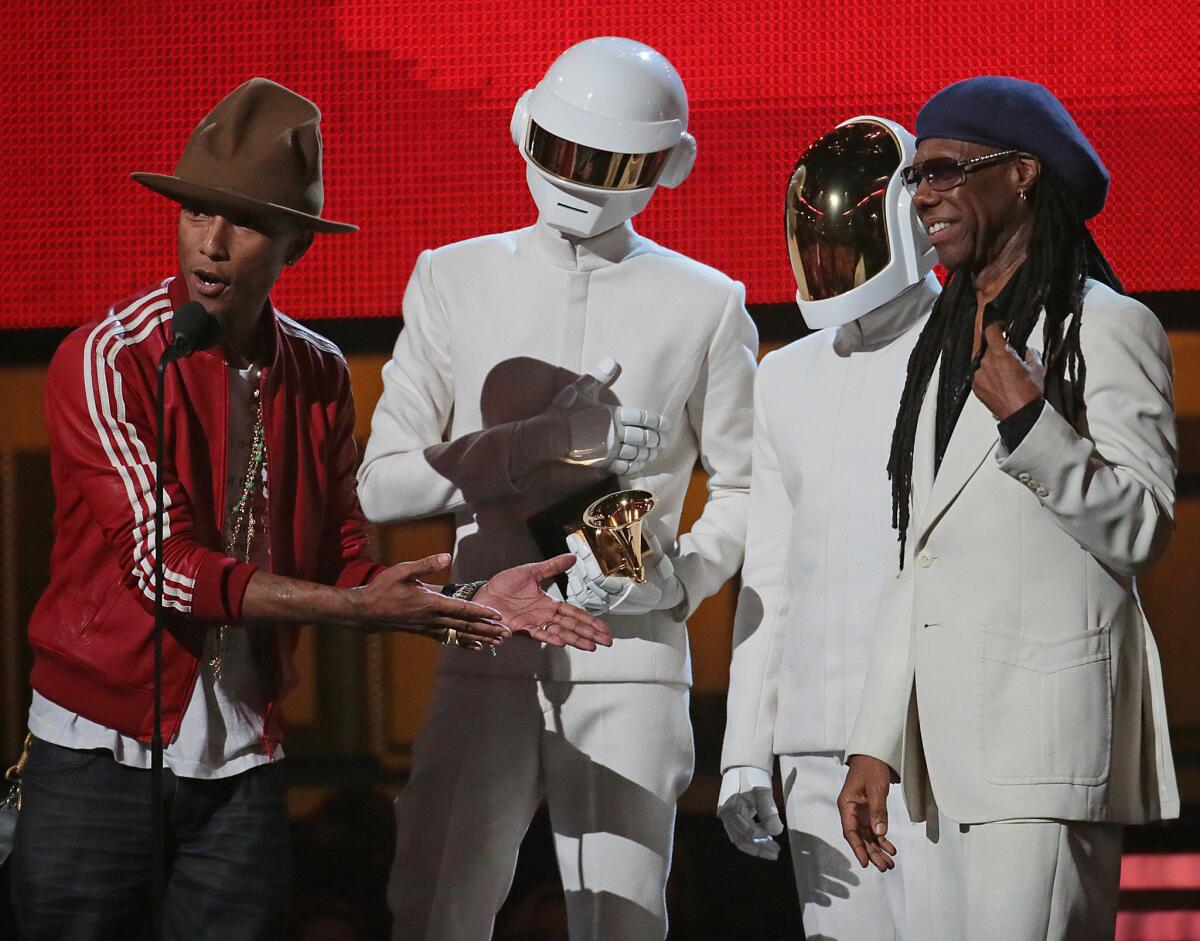 Pharrell Williams, Daft Punk and Nile Rodgers on stage Sunday at the Grammy Awards.