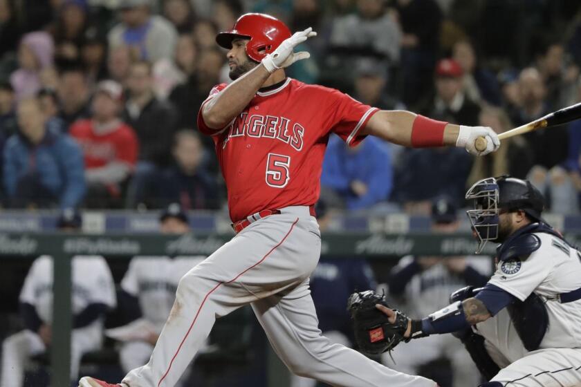 Los Angeles Angels Albert Pujols takes a swing during the eighth inning of a baseball game against the Seattle Mariners, Monday, April 1, 2019, in Seattle. (AP Photo/Ted S. Warren)