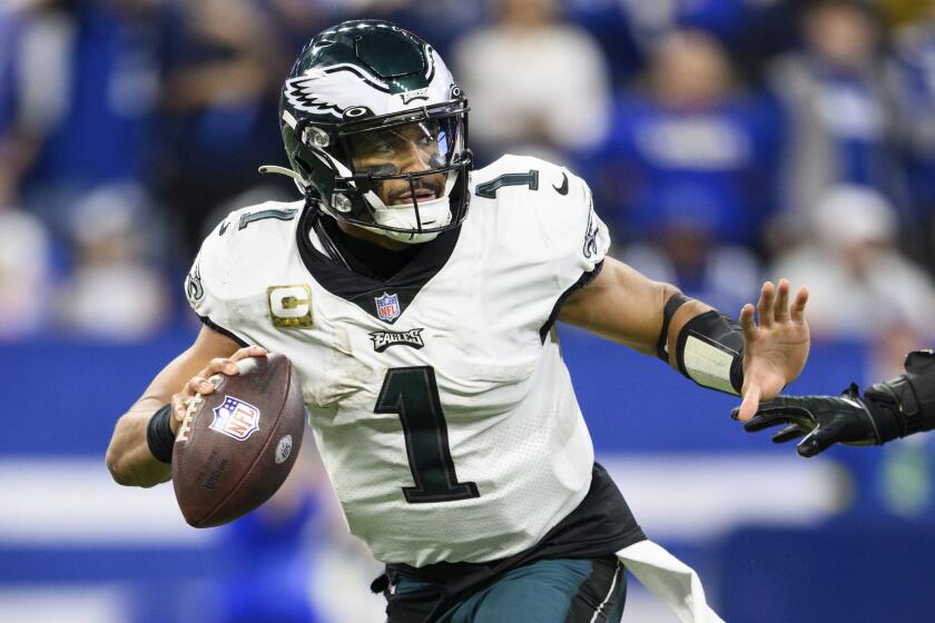 Philadelphia Eagles quarterback Jalen Hurts (1) scrambles from pressure during an NFL football game against the Indianapolis Colts, Sunday, Nov. 20, 2022, in Indianapolis. (AP Photo/Zach Bolinger)