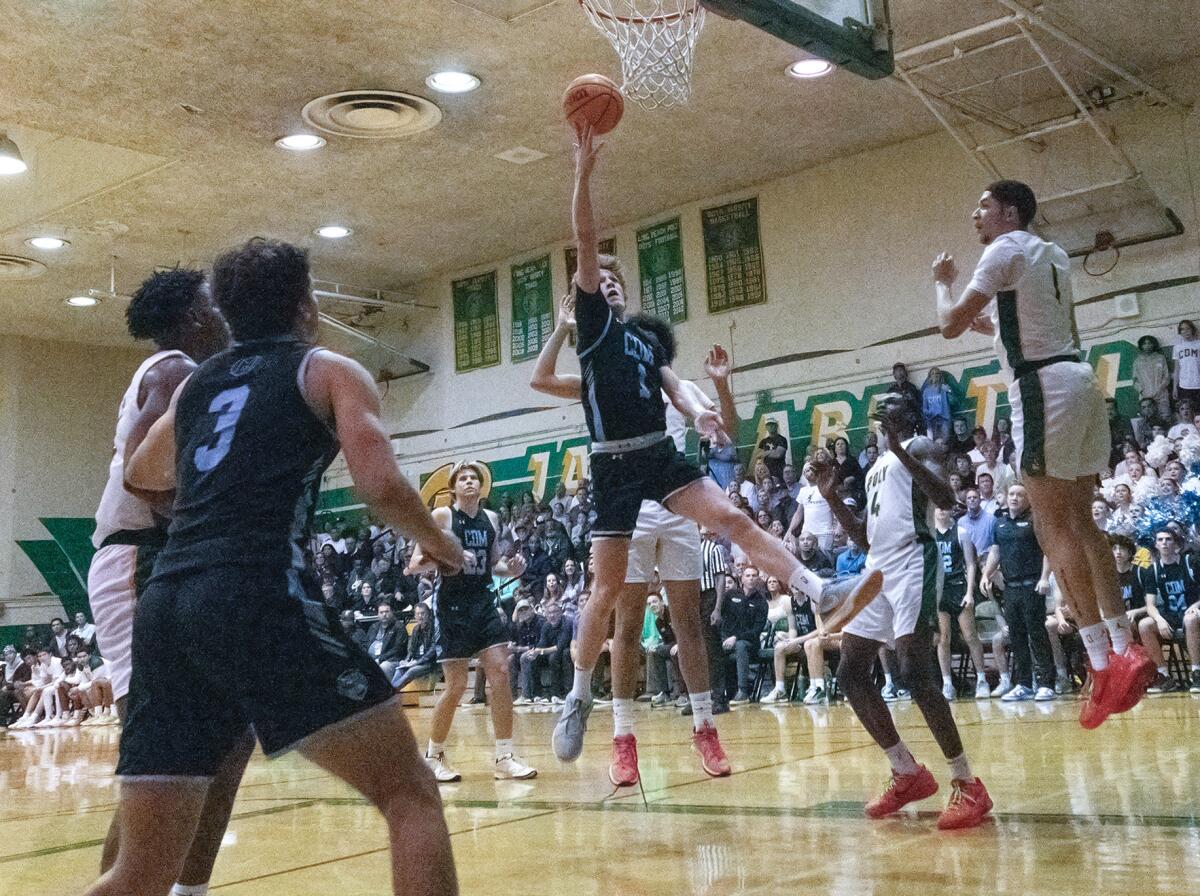 CdM freshman Maxwell Scott gets to the rim for a layup during Friday night's CIF semifinal game at Long Beach Poly. 