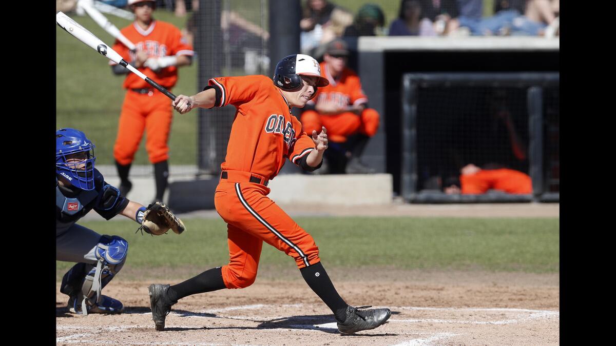 Huntington Beach High's Dylan Ramirez, seen doubling in two runs against Fountain Valley on March 15, drove in the go-ahead run in the Oilers' 8-7 comeback road win over the Barons Wednesday.