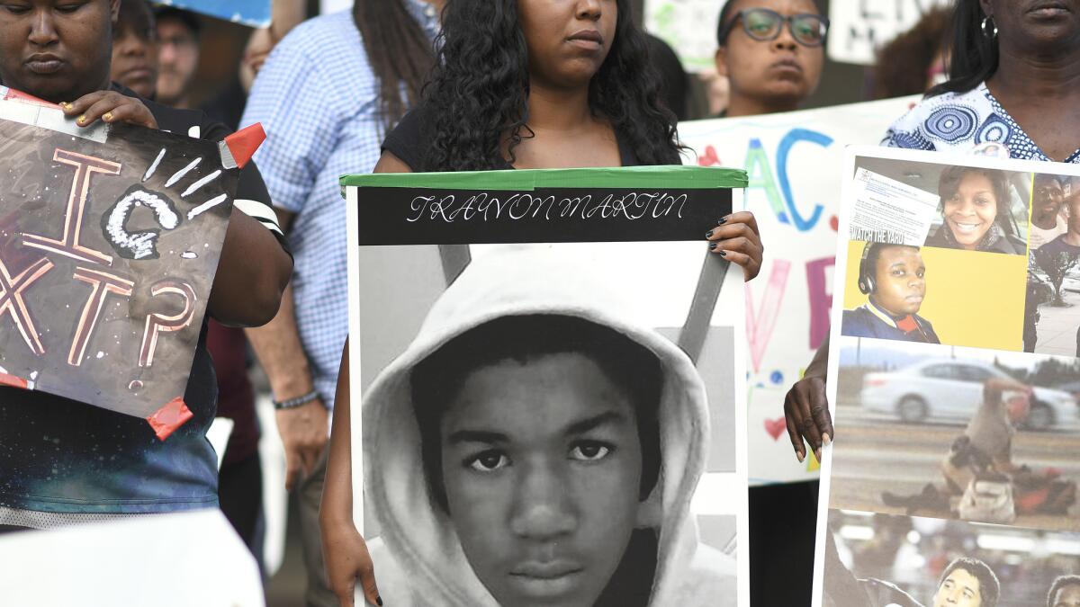 Activists affiliated with the Black Lives Matter movement protest outside L.A. City Hall on Monday.