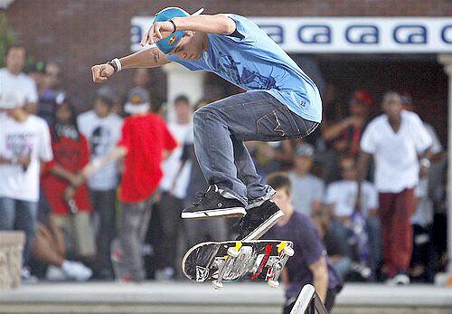Ryan Sheckler does a kick flip as he comes off the rail during a run on the street course at the Maloof Money Cup on Sunday.