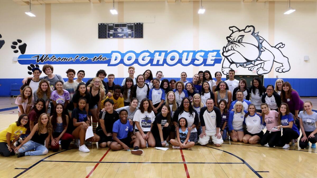 Students and organizers pose for a photo at the end of the Burbank Youth Vocals Arts Foundation annual walkathon at Burbank High School on Saturday. More than 100 students participated and hope to raise about $15,000.