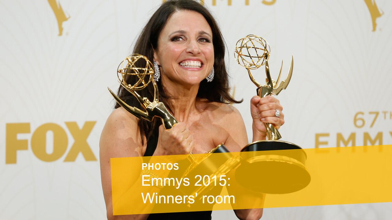 "Veep" star Julia Louis-Dreyfus poses with her Emmy awards for comedy series and lead actress in a comedy series.