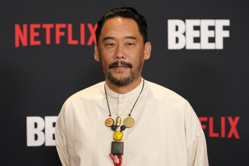 David Choe in a white tunic and abstract necklace at the premiere of Netflix's Beef