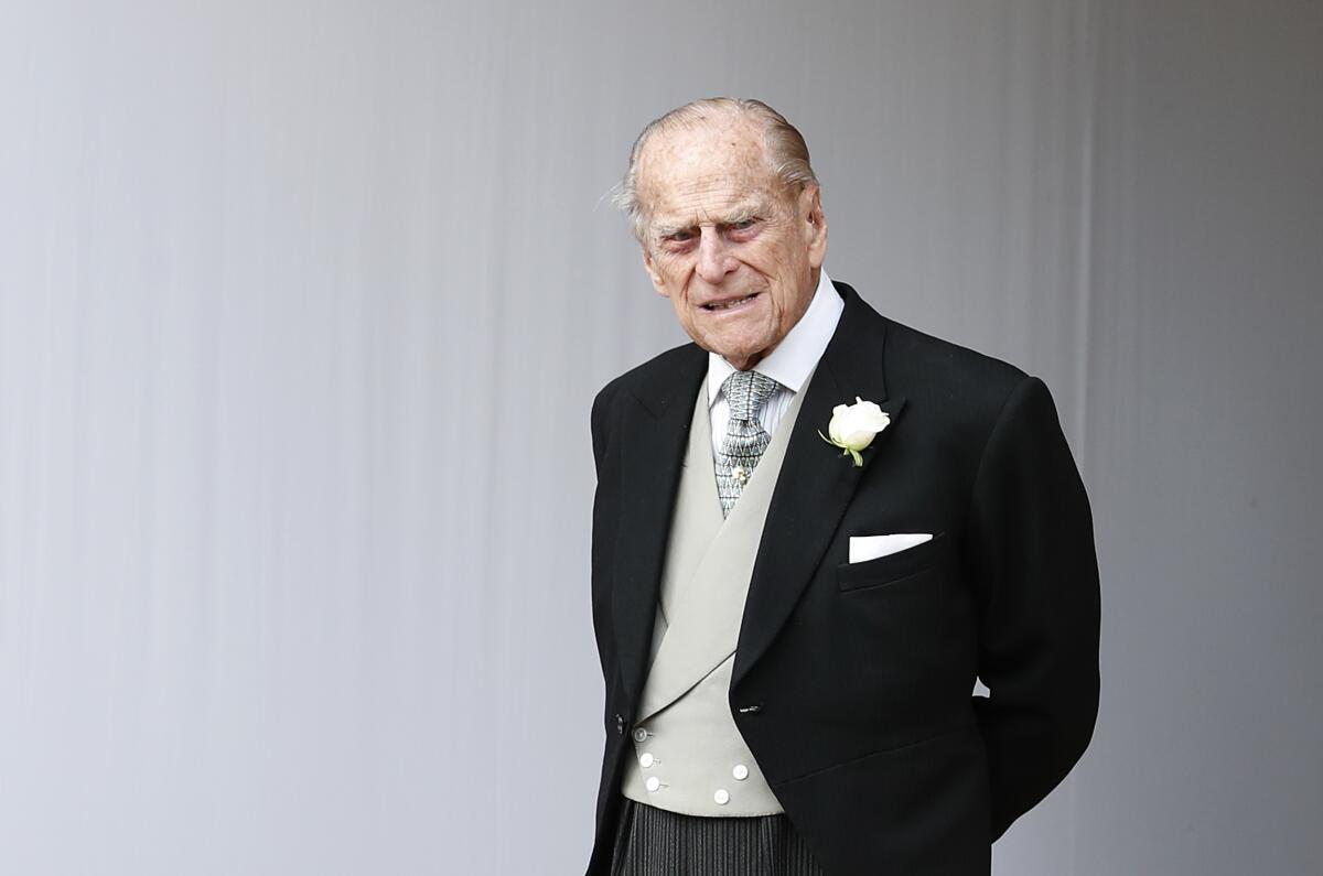 Buckingham Palace says Prince Philip, seen at the 2018 wedding of Princess Eugenie of York, has been admitted to a London hospital “as a precautionary measure.”