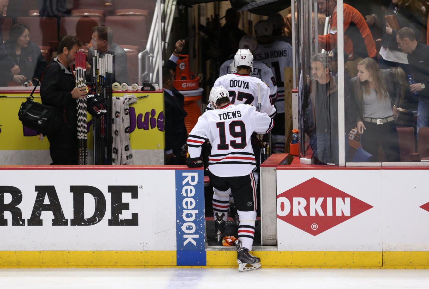 The Blackhawks walk off the ice after a brief overtime.