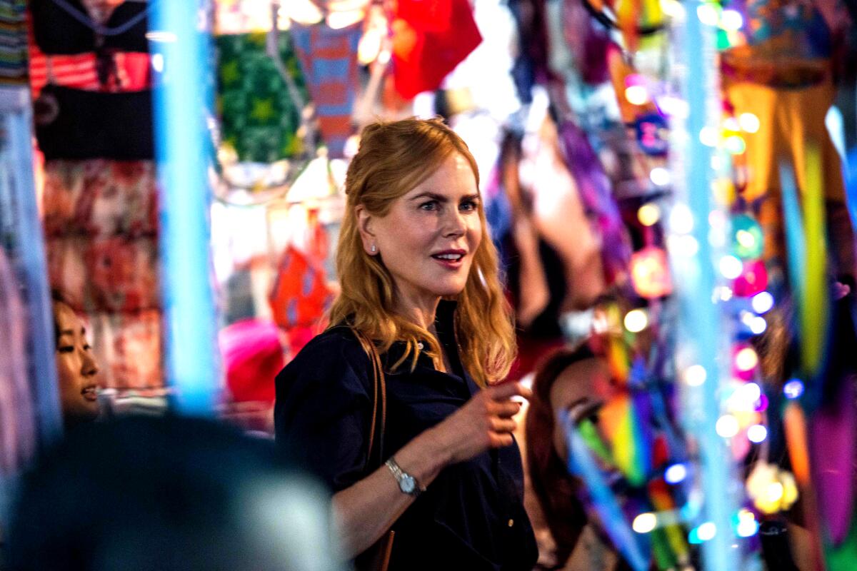 Actress Nicole Kidman films a scene in a colorful market in Hong Kong.