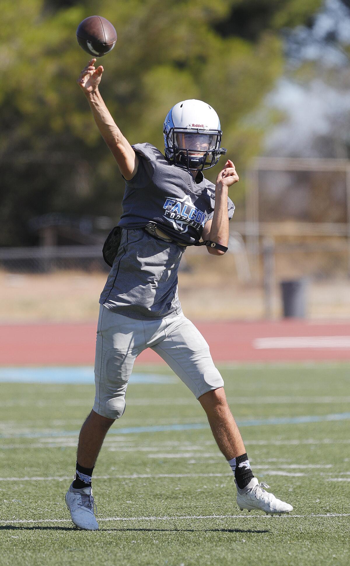 Crescenta Valley quarterback Brendon Pehar throws a pass during a drill at a preseason football practice at Crescenta Valley High School on Thursday, August 15, 2019.