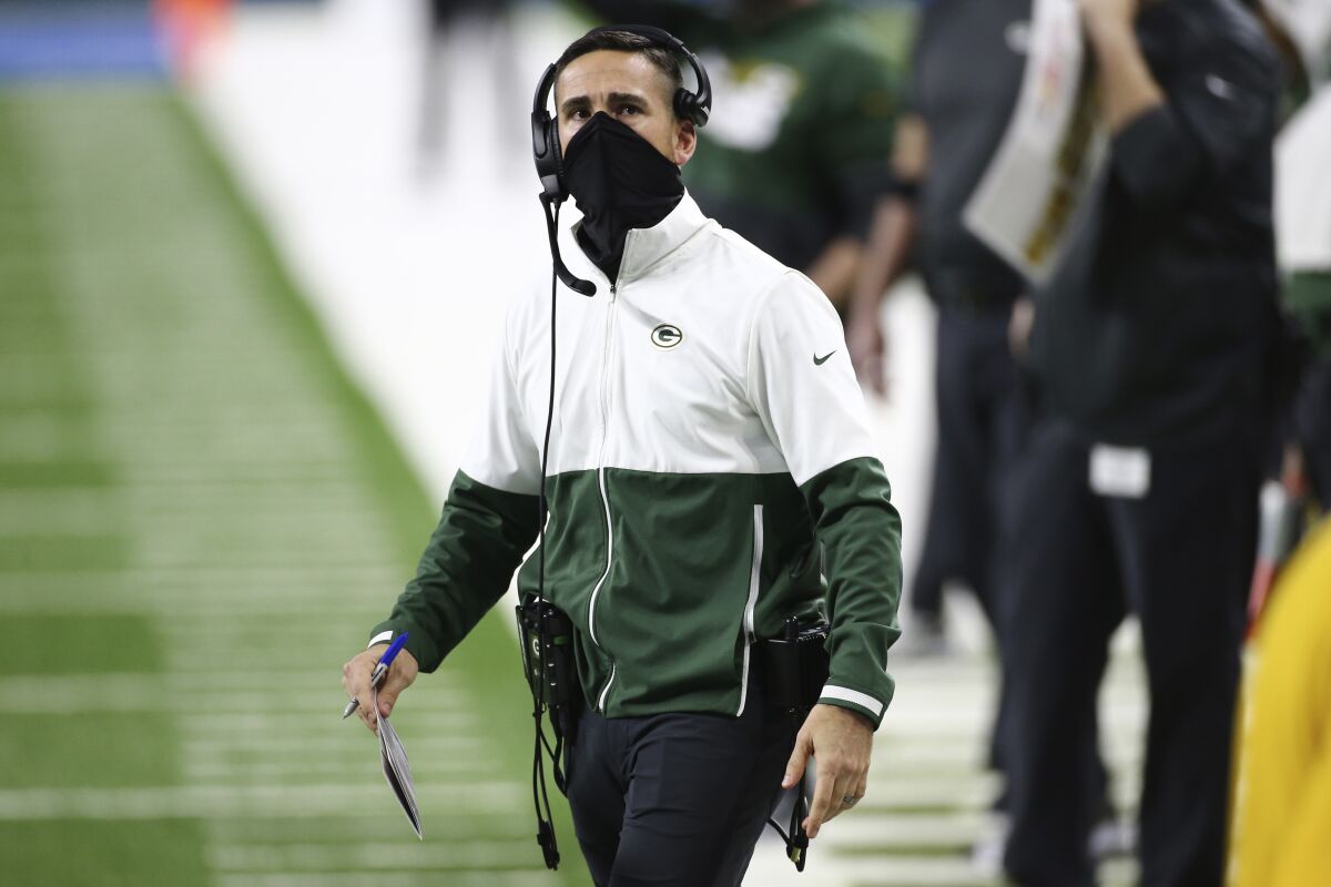 Green Bay Packers coach Matt LaFleur looks at the scoreboard during a game against the Lions.