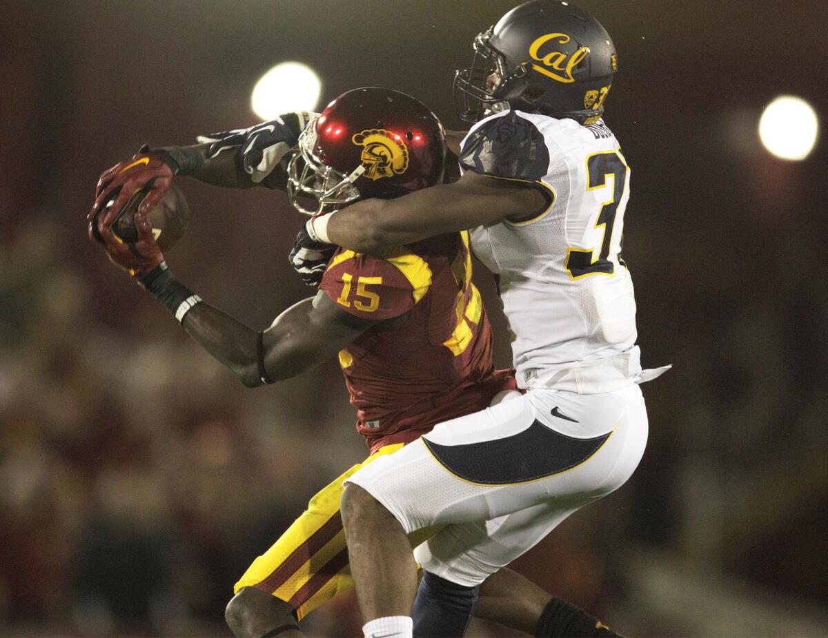 USC wide receiver Nelson Agholor hangs on for a 34-yard touchdown pass on Nov. 13.