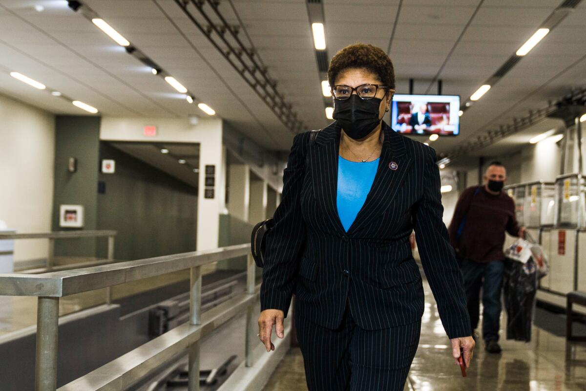 Rep. Karen Bass walks in the hallways of the U.S. Capitol in February. 