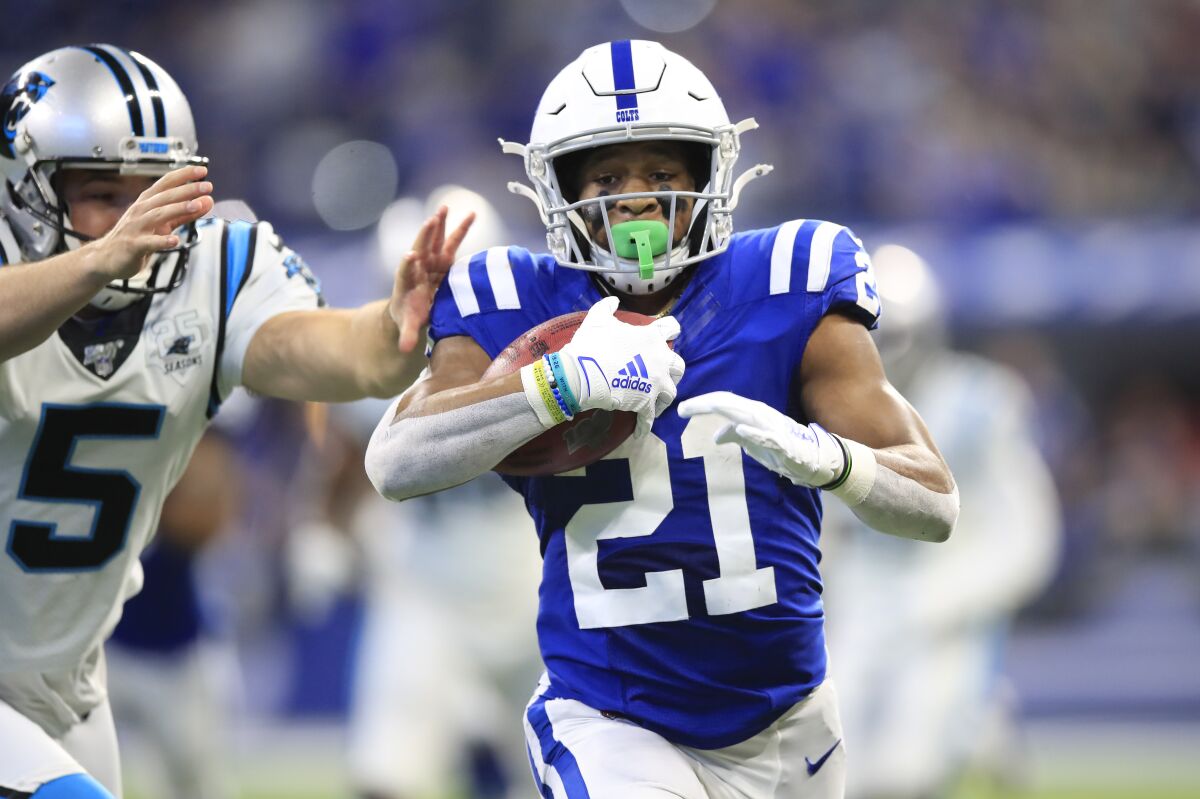 Indianapolis Colts punt returner Nyheim Hines scores a touchdown.