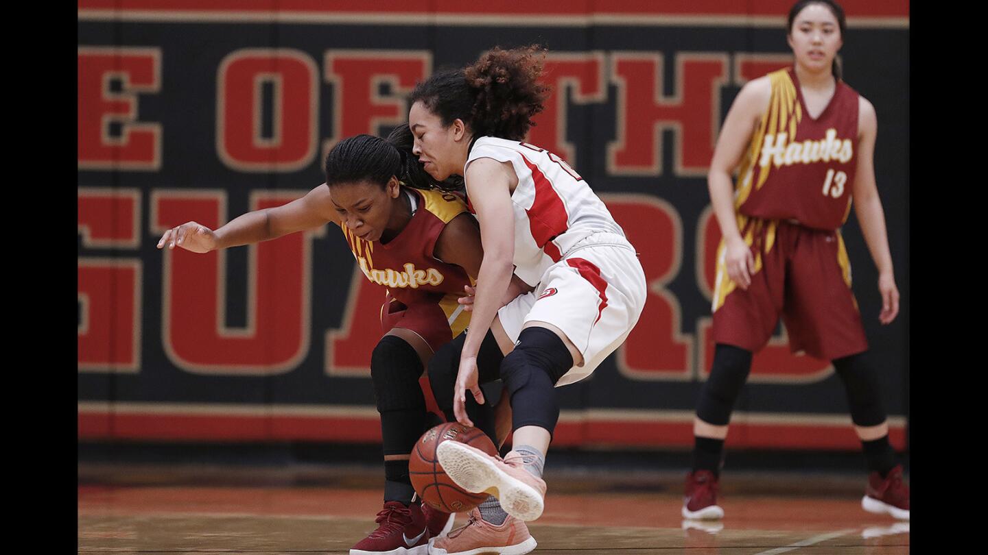 Ocean View's Hosanna Walker attempts to steal the ball from Segerstrom's Tati Zazuetta during a Golden West League game on Thursday, January 25.