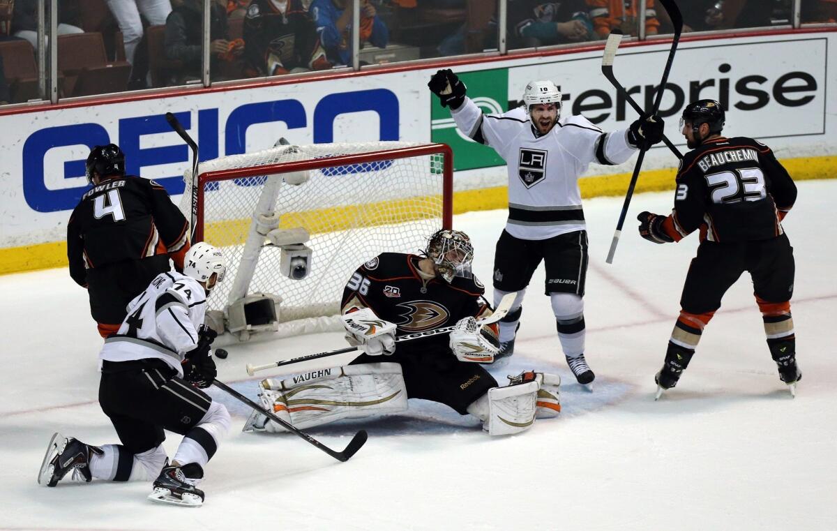 Kings winger Dwight King and center Mike Richards react after Richards scores a goal against John Gibson and the Ducks in Game 7 of their first-ever playoff meeting.