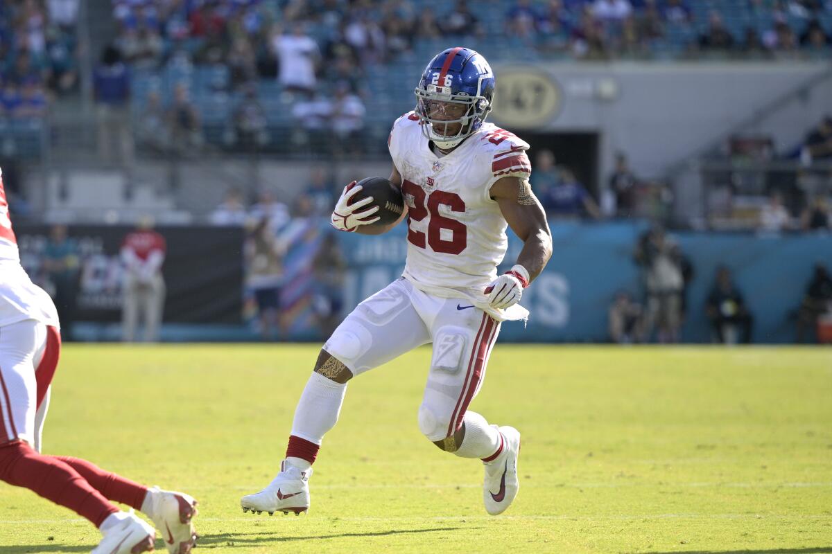 New York Giants running back Saquon Barkley rushes for yardage during the second half against the Jacksonville Jaguars.