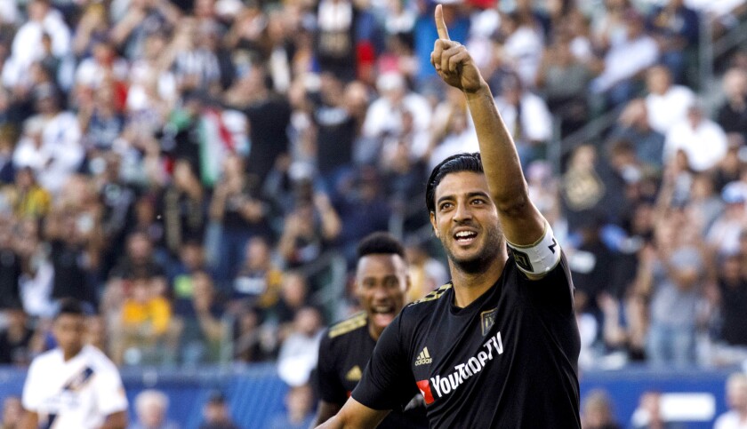 LAFC forward Carlos Vela celebrates after scoring a goal during the first half of a game against the Galaxy.