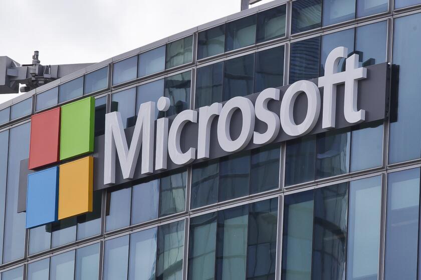 FILE - This April 12, 2016 file photo shows the Microsoft logo in Issy-les-Moulineaux, outside Paris, France. Microsoft says state-backed Russian and North Korean hackers have in recent months tried to steal valuable data from leading pharmaceutical companies and COVID-19 vaccine researchers. (AP Photo/Michel Euler, File)