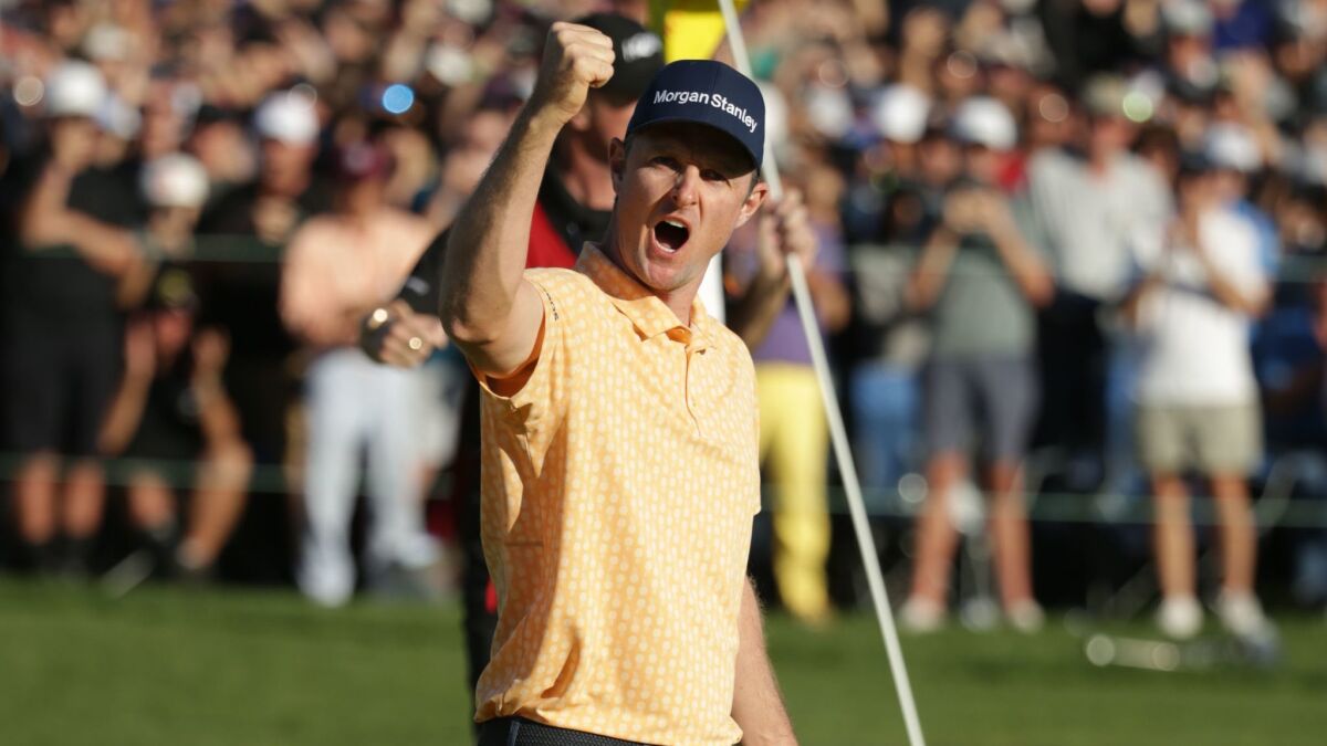 Justin Rose celebrates his winning putt on the 18th green on the South Course during the final round of the Farmers Insurance Open at Torrey Pines.