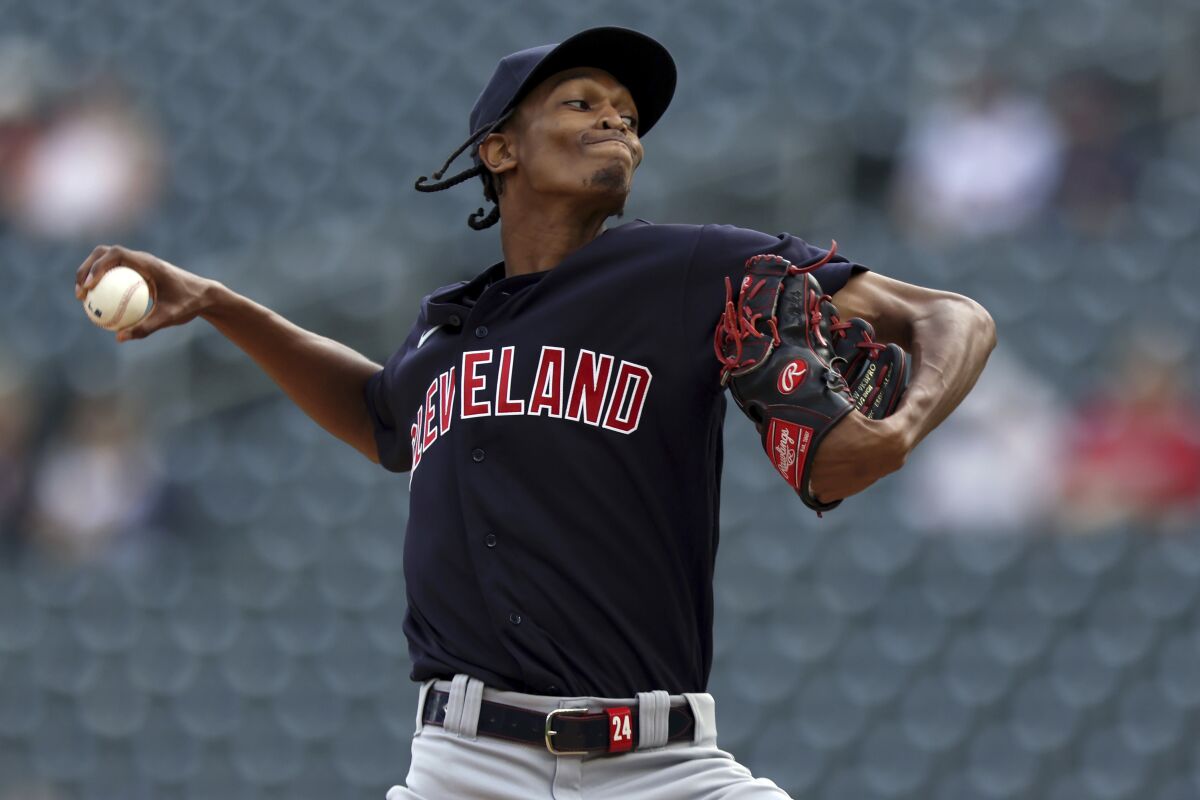 Cleveland Indians' pitcher Triston McKenzie (24) throws against the Minnesota Twins during the first inning of the first baseball game of a doubleheader Tuesday, Sept. 14, 2021, in Minneapolis. (AP Photo/Stacy Bengs)