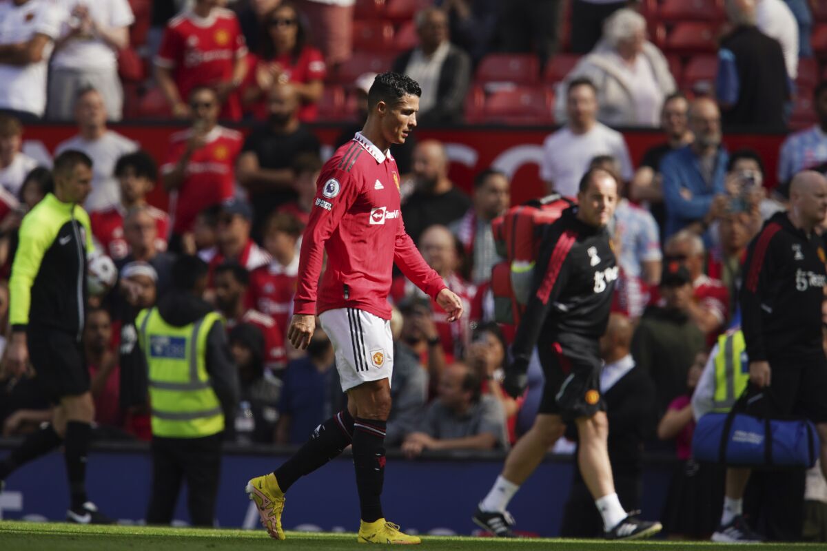 Manchester United's Cristiano Ronaldo walks on the field at the end of the English Premier League soccer match between Manchester United and Brighton at Old Trafford stadium in Manchester, England, Sunday, Aug. 7, 2022. Brighton won 2-1. (AP Photo/Dave Thompson)