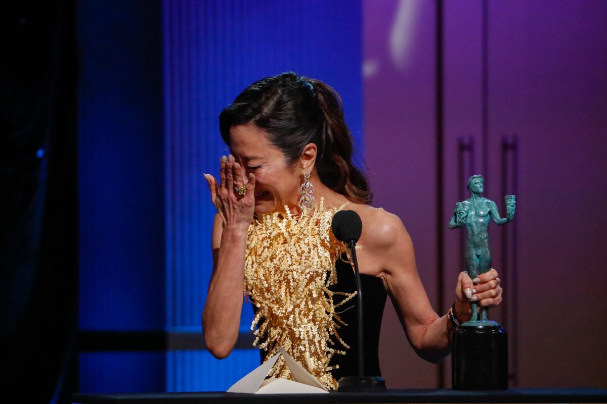 Michelle Yeoh accepts the award for female actor in a leading role at the 29th Annual Screen Actors Guild Awards in L.A.