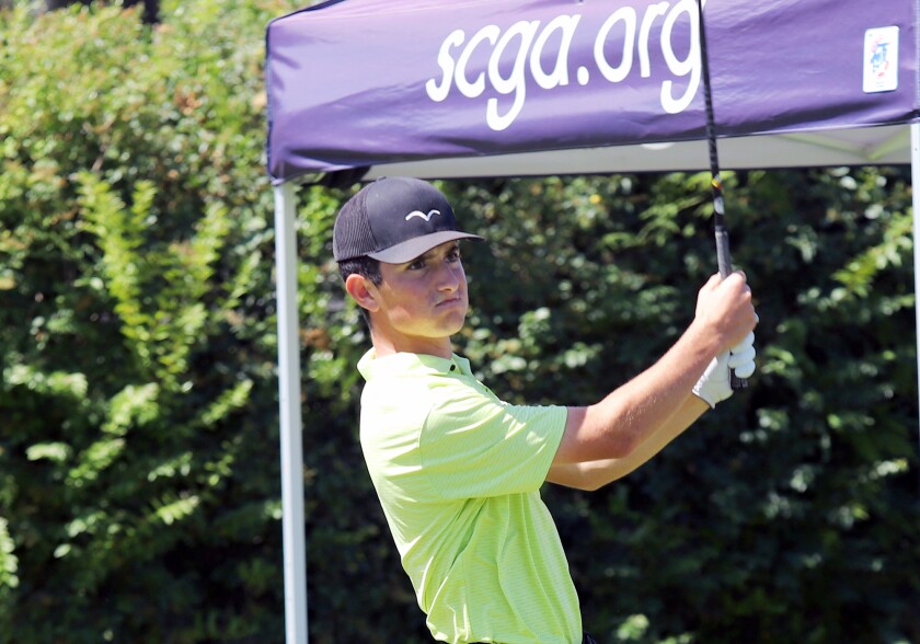 Edison's Troy Tarvin tees off at the 10th hole during the CIF State boys' golf championship at the San Gabriel Country Club.