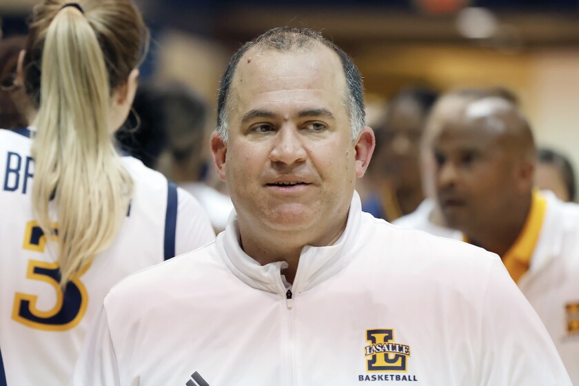 La Salle NCAA women's college basketball head coach Mountain MacGillivray is shown after a game against Drexel in Philadelphia, Nov. 17, 2021. MacGillivray is raising awareness of pediatric cancer. His 2-year-old daughter Emily was diagnosed last year with acute lymphoblastic leukemia. (Elizabeth Robertson/The Philadelphia Inquirer via AP)