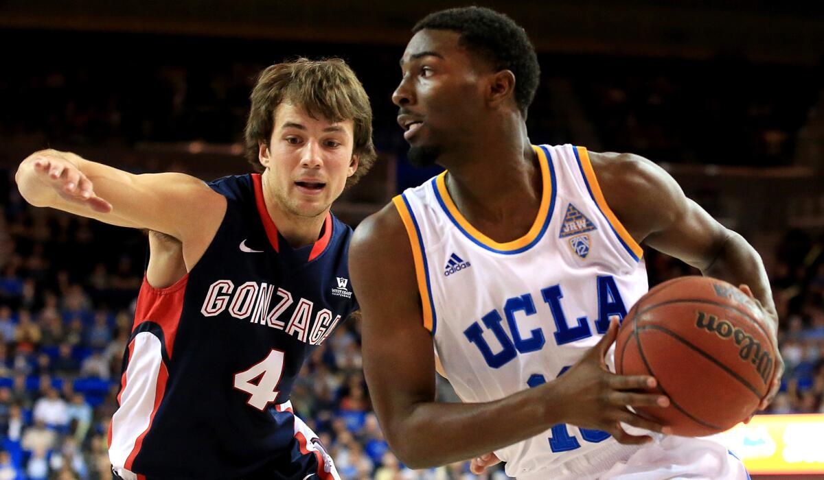 UCLA guard Isaac Hamilton drives to the basket against Gonzaga guard Kevin Pangos during their game earlier this season at Pauley Pavilion.