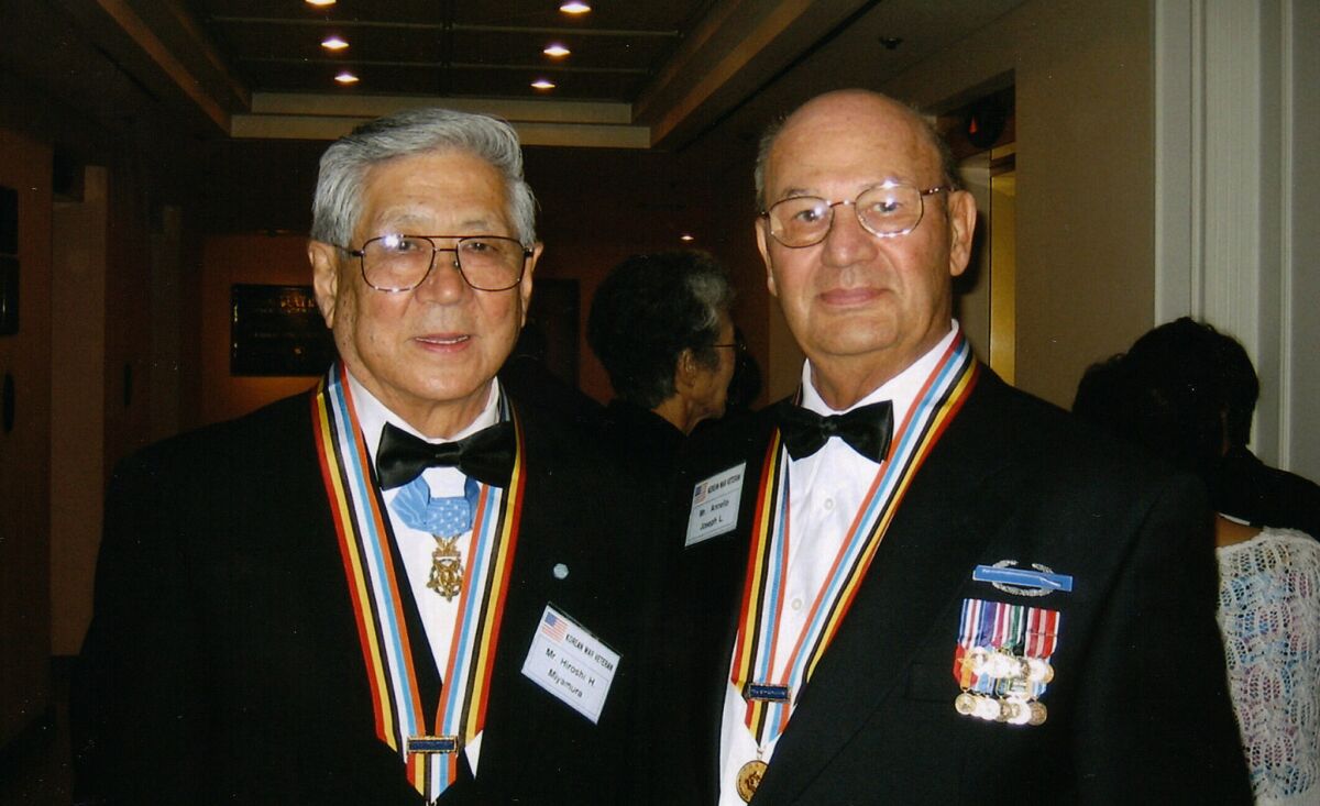 Hiroshi "Hershey" Miyamura, left and Joe Annello, who both fought in the Korean War, in 2005. "“From the first day we met in that tent,” Annello said, “we knew we were going to become friends.” (Courtesy of Joe Annello)