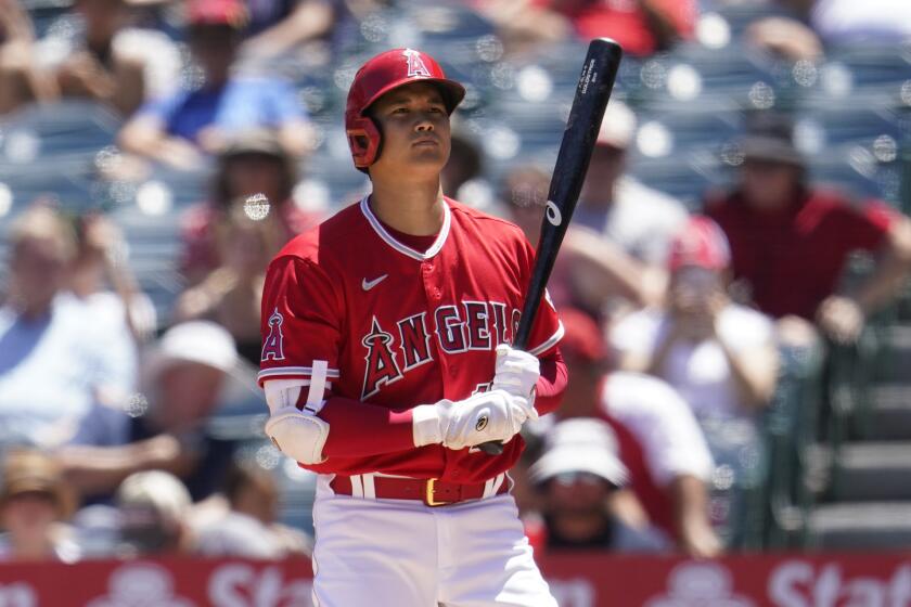 Los Angeles Angels' Shohei Ohtani prepares to bat during a baseball game against the Minnesota Twins Sunday, Aug. 14, 2022, in Anaheim, Calif. (AP Photo/Marcio Jose Sanchez)