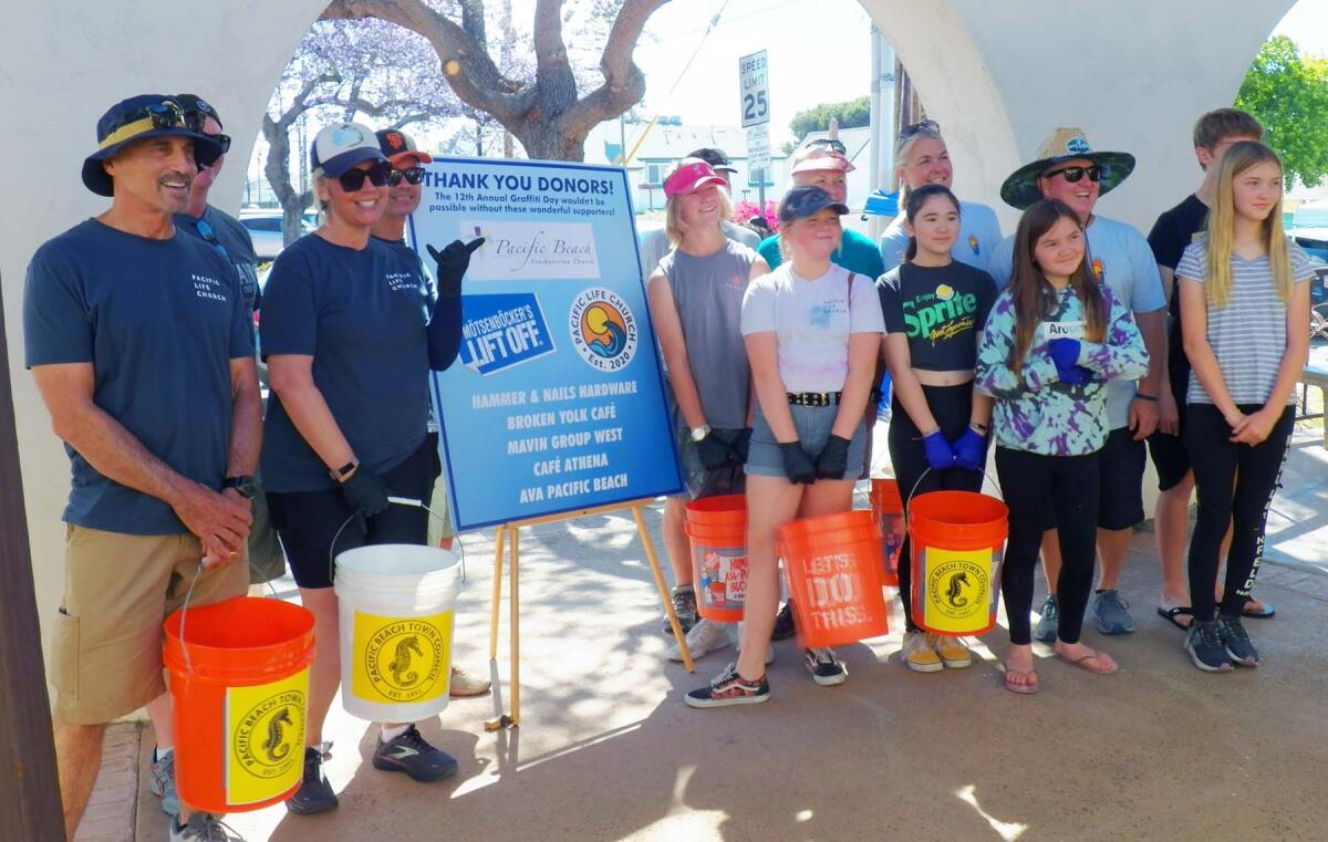 Volunteers from Pacific Life Church ready to begin graffiti removal in Pacific Beach.