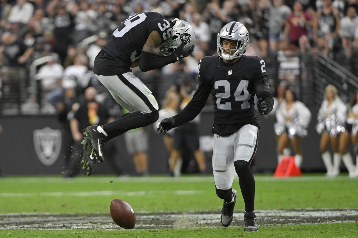 Las Vegas Raiders cornerback Nate Hobbs (39) reacts after missing an interception against the Washington Football Team during the second half of an NFL football game, Sunday, Dec. 5, 2021, in Las Vegas. (AP Photo/David Becker)