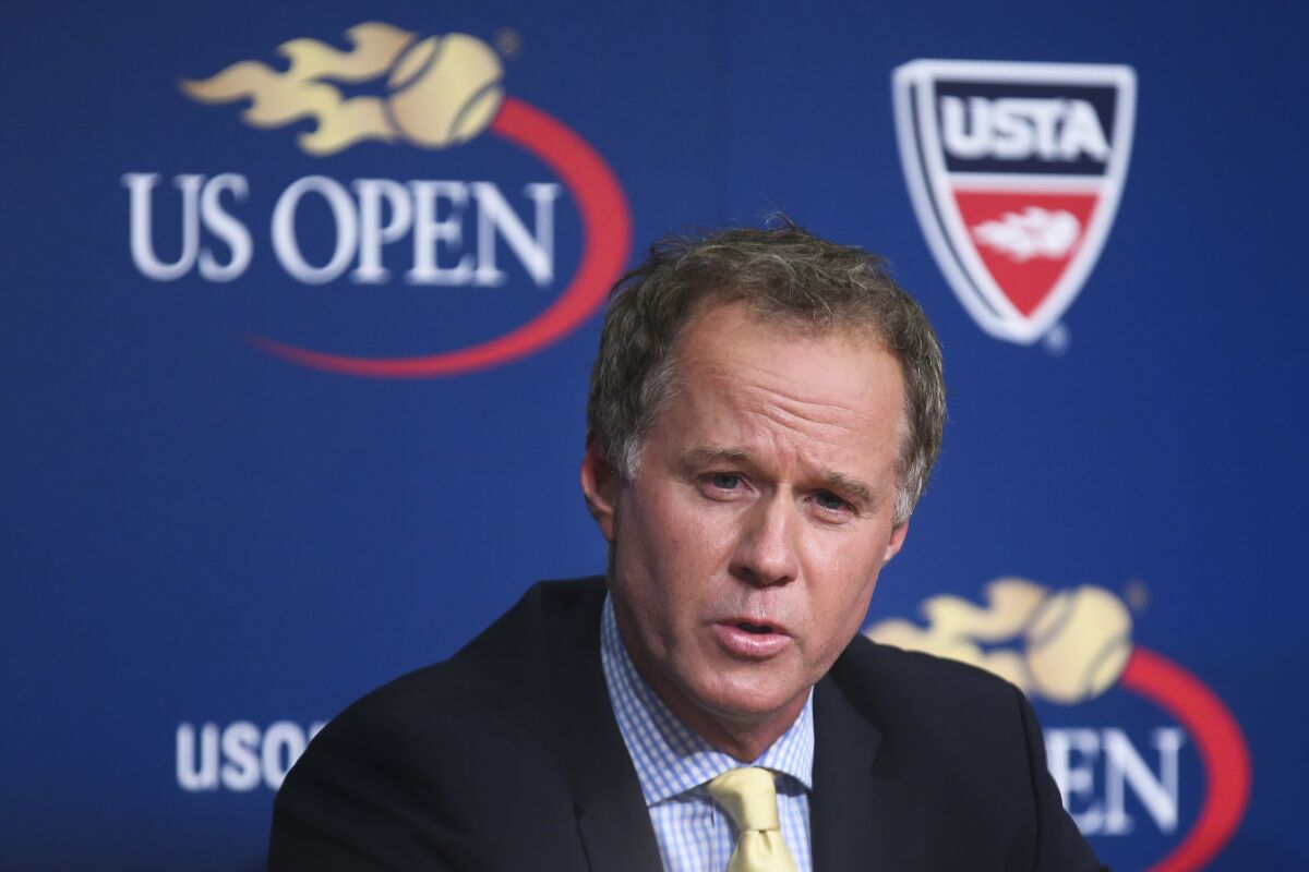 FILE - Patrick McEnroe speaks during a news conference at the U.S. Open tennis tournament in New York, Sept. 3, 2014. Former player and current TV analyst Patrick McEnroe will be the new president of the International Tennis Hall of Fame, and USTA Foundation chief executive Dan Faber was chosen as the Hall's new CEO. The Hall announced the appointments on Thursday, March 9, 2023, and said McEnroe and Faber will begin their roles on May 1. (AP Photo/John Minchillo, File)