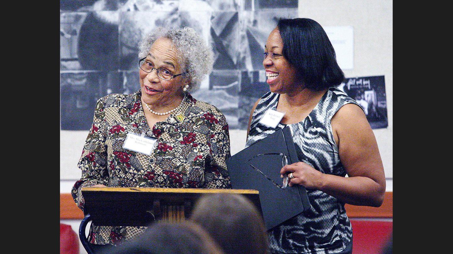 With her daughter, Kathy Robinson-Young, standing to her left, Delano Robinson, wife of 1936 Olympic silver medalist Mack Robinson, speaks to Flintridge Prep students at a presentation sponsored by the student-run Athletic Council on Wednesday, March 29, 2017.